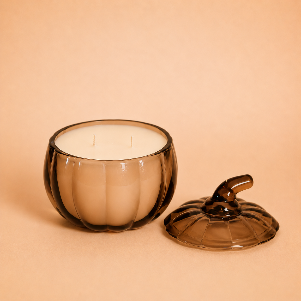 Luxury amber pumpkin fall candle by Luminosa Vida featuring a double wick coconut wax candle in a reusable glass pumpkin vessel, perfect for autumn home decor and cozy seasonal fragrance.