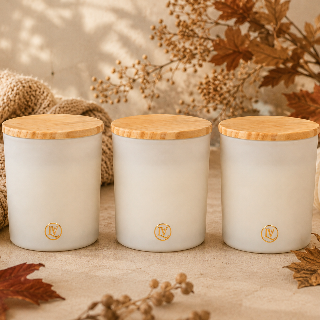 Luminosa Vida Fall Candle Trio with three candles in a warm neutral autumn setting