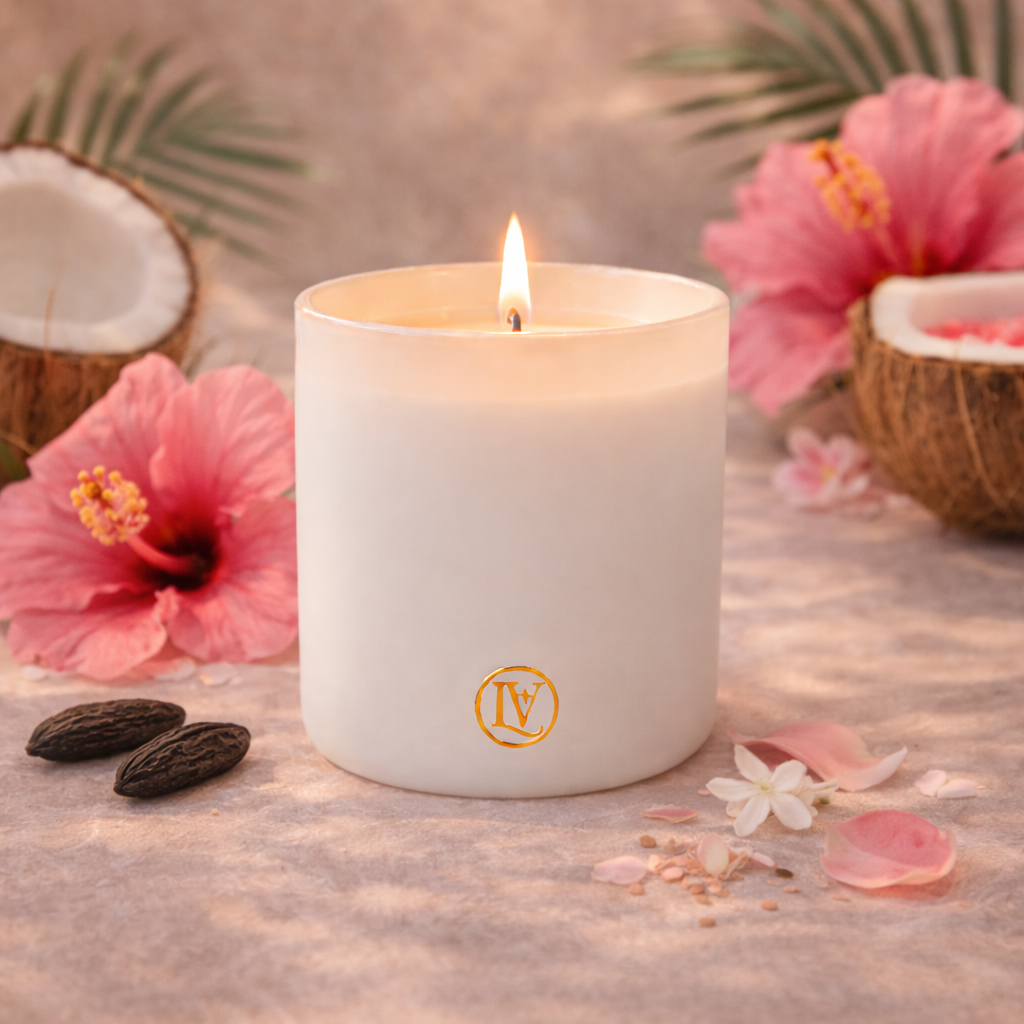 Luminosa Vida luxury candle with pink coconut, hibiscus and tonka bean in a tropical lifestyle scene.