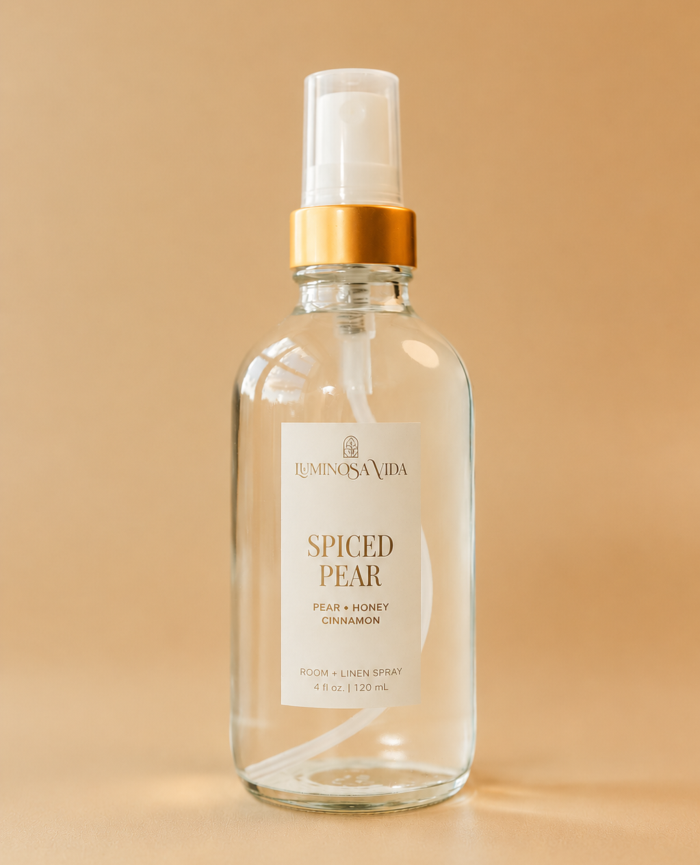Spiced Pear Room & Linen Spray by Luminosa Vida featuring notes of pear, honey, and cinnamon. Clean, phthalate-free room spray for refreshing linens and creating a cozy fall home fragrance.