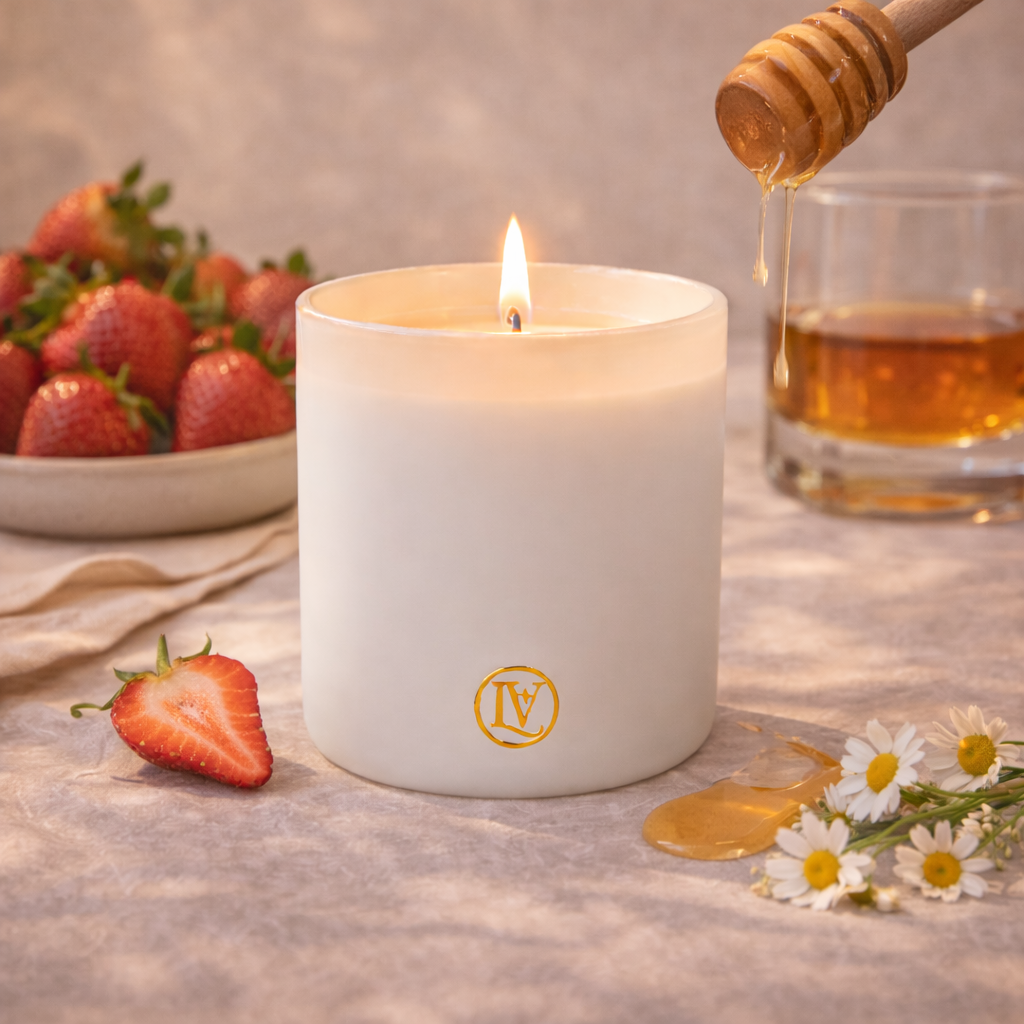 Luminosa Vida luxury candle with strawberry, bourbon and nectar in a warm lifestyle scene.