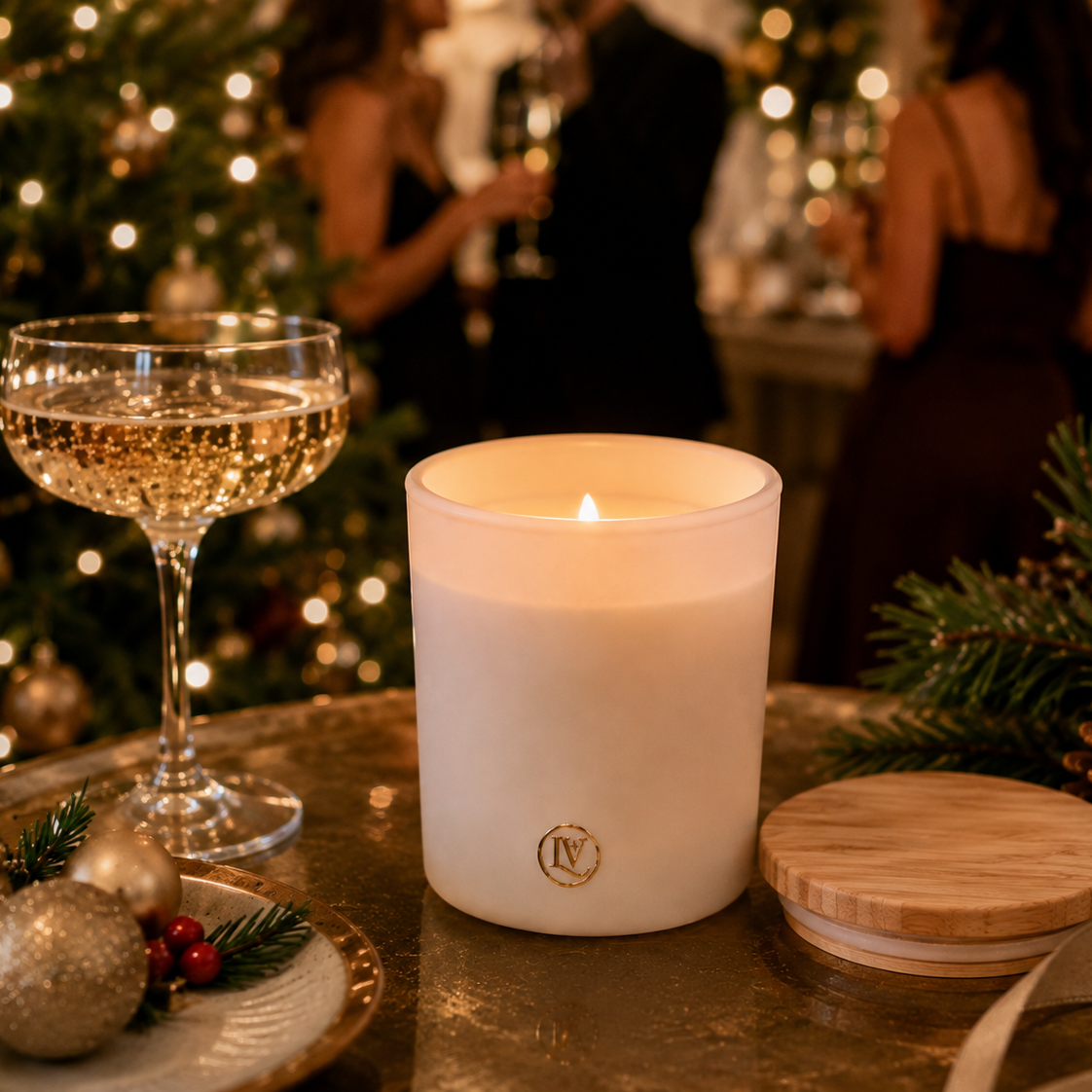 Christmas Bubbles luxury Christmas candle by Luminosa Vida displayed at a holiday party with champagne, Christmas tree lights, and festive decor, creating a warm holiday home fragrance experience.