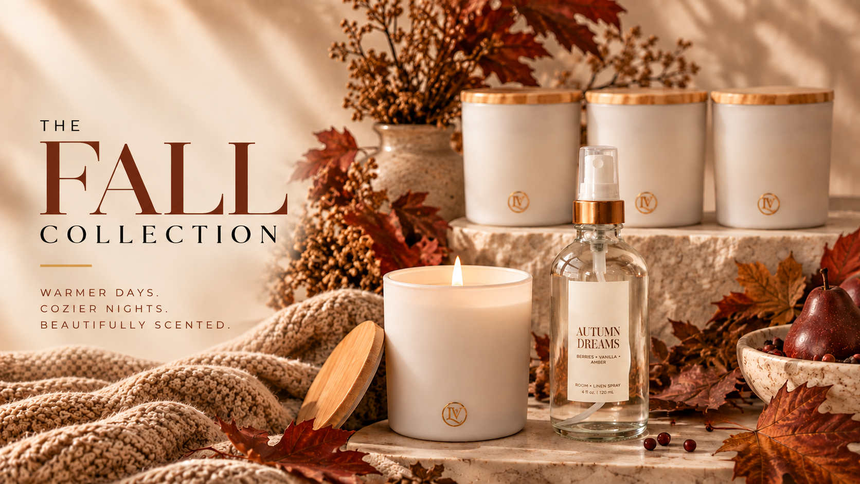 Luminosa Vida Fall Collection featuring luxury coconut wax candles and room sprays styled with cozy autumn leaves and warm seasonal decor.