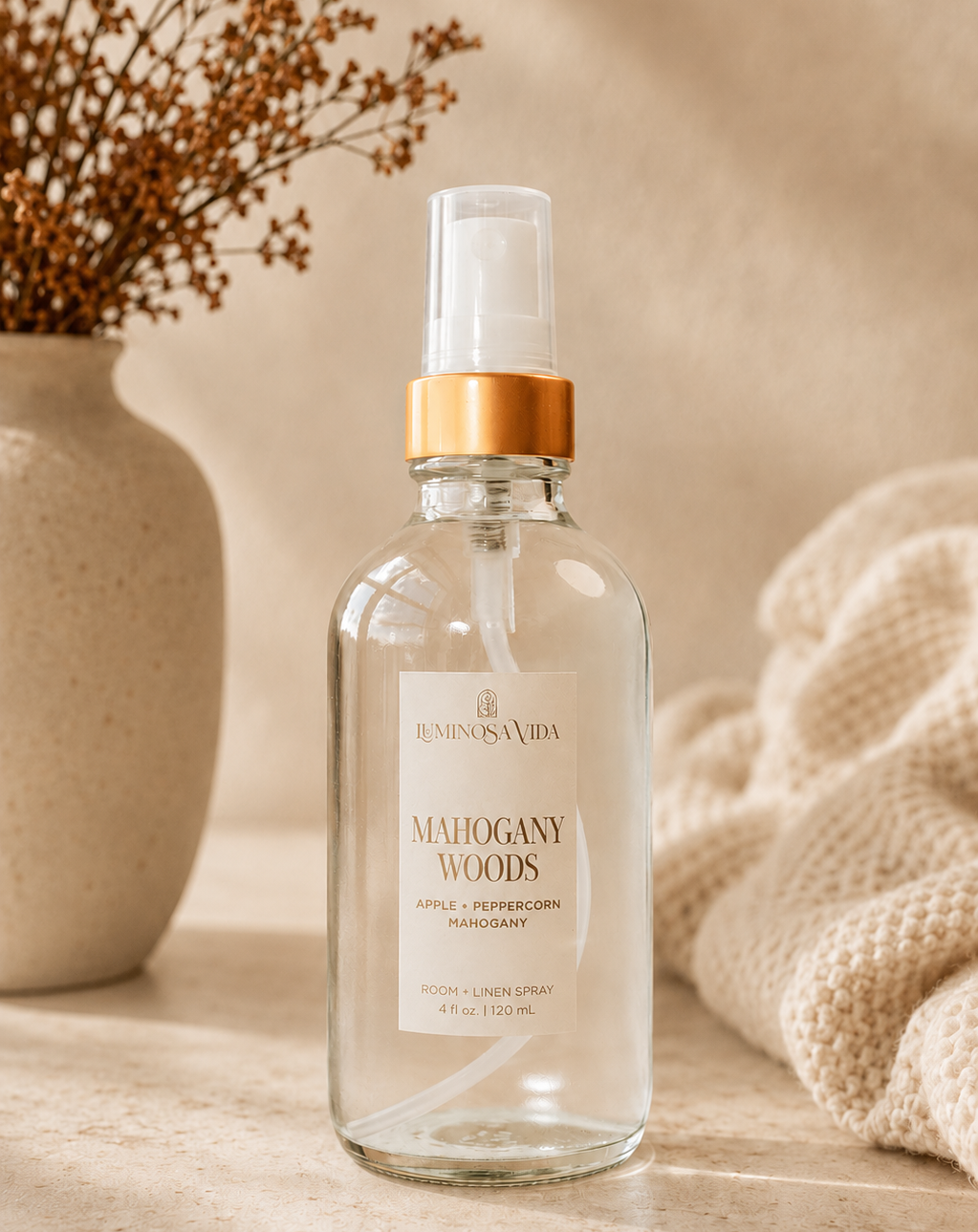 Mahogany Woods Room & Linen Spray by Luminosa Vida styled in a cozy fall-inspired home with apple, peppercorn, and mahogany notes. Clean, phthalate-free room spray for linens, bedding, and warm woodsy home fragrance.