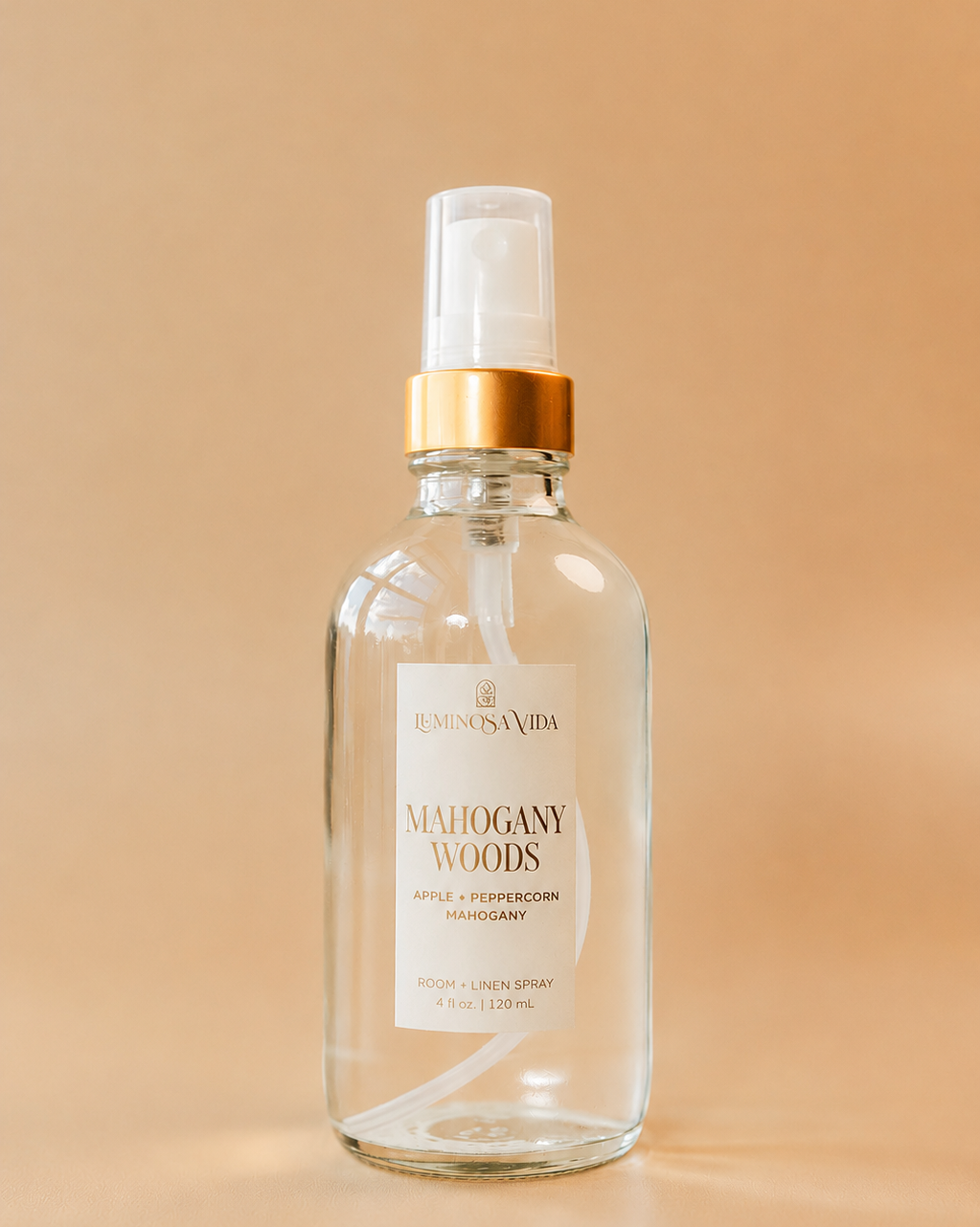 Mahogany Woods Room & Linen Spray by Luminosa Vida featuring apple, peppercorn, and mahogany notes. Clean, phthalate-free room spray for refreshing linens and creating a warm, woodsy fall home fragrance.